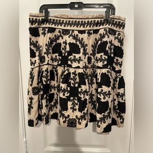 Black and beige embroidered anthropology skirt.